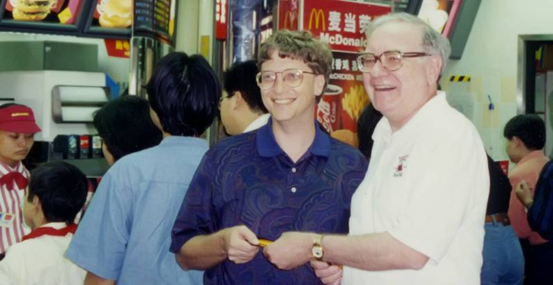 Bill Gates and Warren Buffett at a McDonald's restaurant together. 