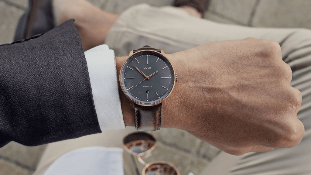 Man wearing a MVMT watch in black and brown