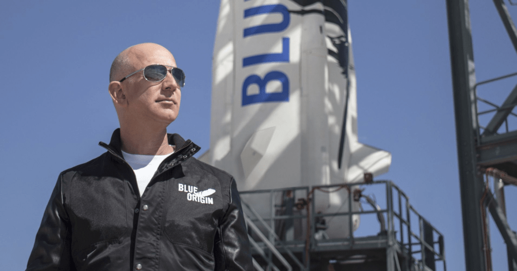 Jeff Bezos in front of a Blue Origin spacecraft