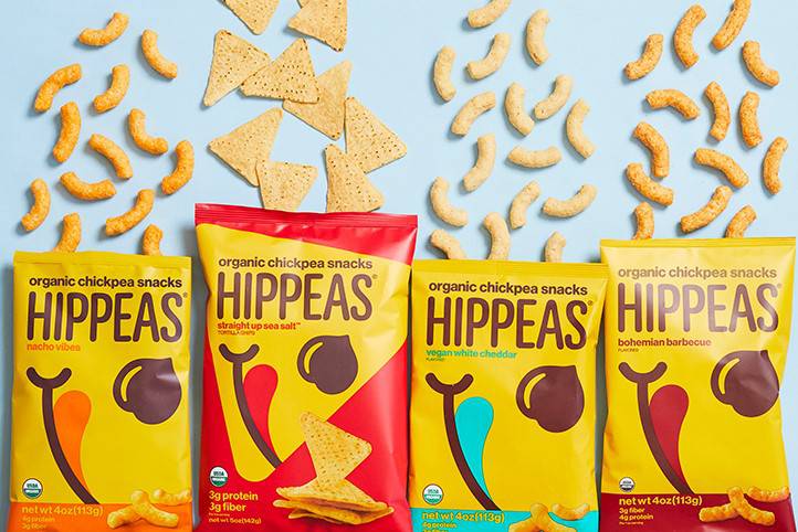 Promotional image showing four varieties of Hippeas chickpea snacks.
